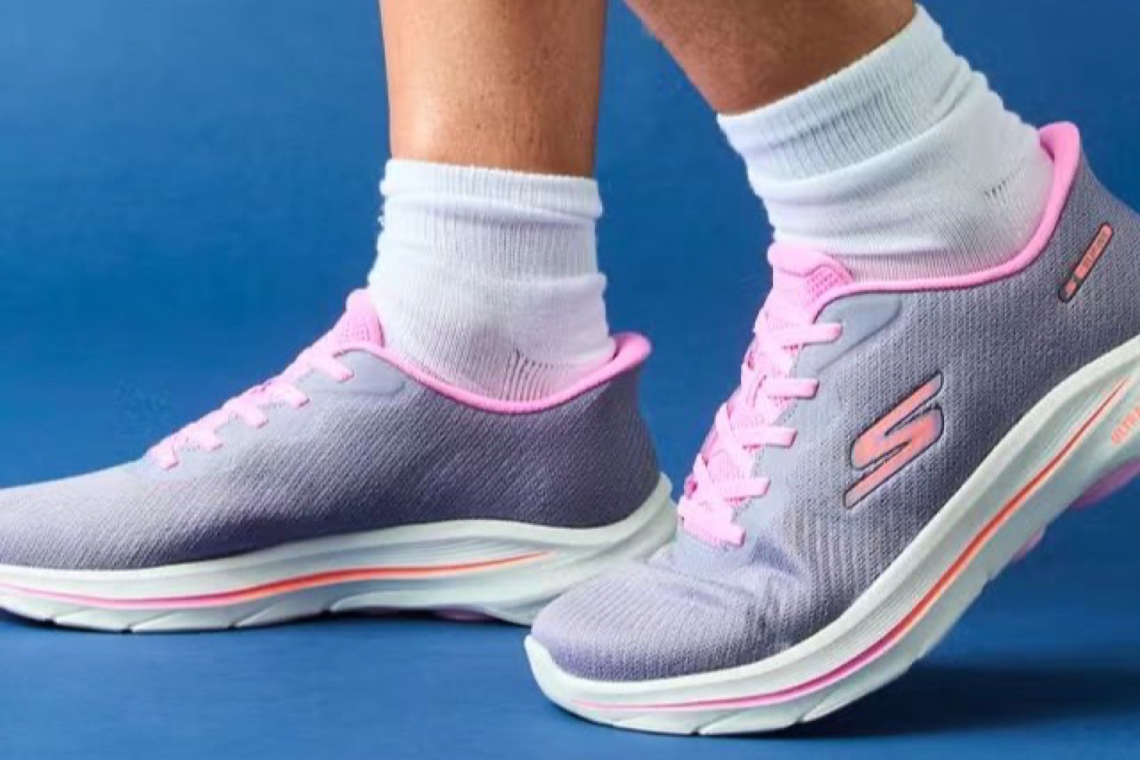 Skechers Go Walk cushioned walking sneakers used as a Slow Man shoes alternative
